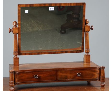 A William IV mahogany toilet mirror, the concave two drawer base with outstepped lappet carved supports on melon feet, 64cm w