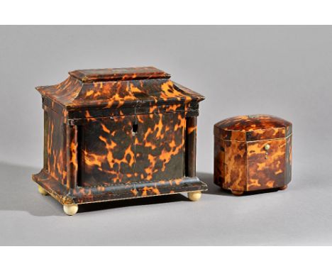 A Regency tortoiseshell tea caddy, the swept rectangular top enclosing a twin lidded interior, 20cm wide x 18cm high, and a G