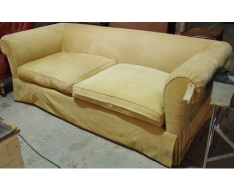 A 20th century hardwood framed sofa with roll over arms and mustard upholstery, 230cm wide. 