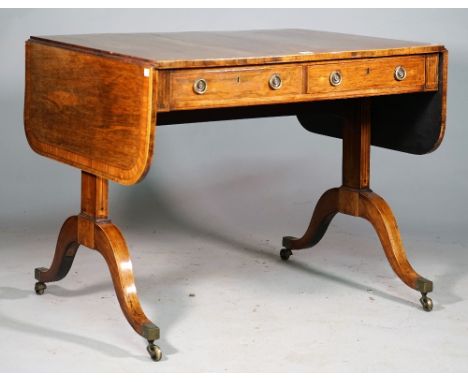 A late George III satinwood banded rosewood sofa table, with pair of frieze drawers and dummy opposing, on four downswept sup