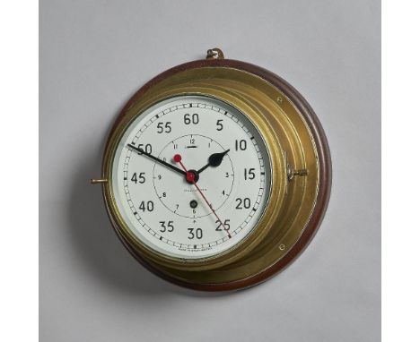 A ship's brass capstan timepieceWith white-painted dial, sweep centre seconds and Admiralty arrow, bevelled glazed bezel, dru