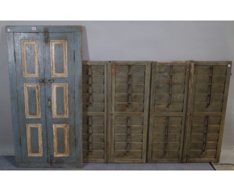 A 20th century blue painted window shutter with later added mirror 62cm wide x 122cm high and an early 20th century set of fo