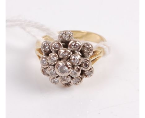 An 18ct gold diamond cluster ring in a tiered surround of 20 old cut diamonds, 5.3g, size K