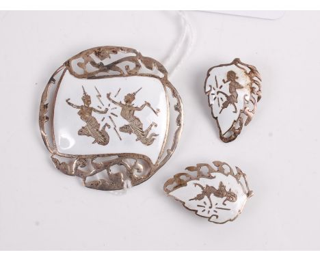 A sterling silver and white enamel brooch together with matching ear clips, each stamped verso Siam Sterling
