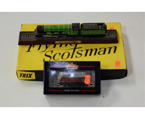 A boxed Bachmann 12-ton planked ventilated van and a Trix Flying Scotsman