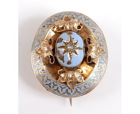 A yellow metal Victorian mourning brooch, comprising an oval border with pale blue enamel inlay and a centre section of four 