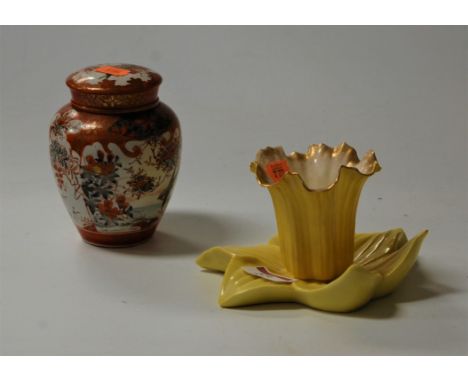 A Royal Worcester Chinaworks vase, in the form of a daffodil head, on a yellow ground heightened in gilt, printed mark verso,