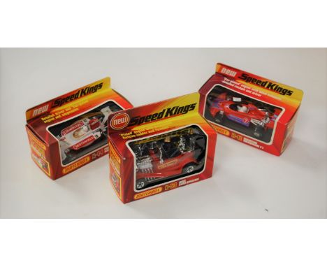 A boxed Matchbox Speedkings Formula 1 racing car; together with a Hot fire engine; and a Martini F1 racing car