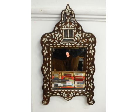 A 20th century eastern mother of pearl inlaid wall mirror with a bevelled plate, height 60cm, width 31cm