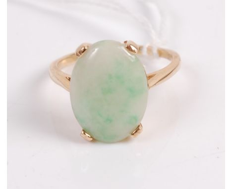 A 14ct gold and cabochon spinach jade set dress ring, the jade stone measuring approx 17x11x4mm, 5.5g, size T