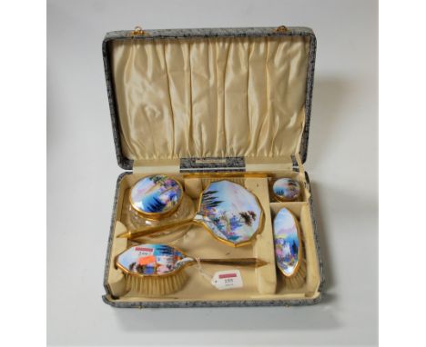 A 1950s hand-painted and enamelled lady's dressing table set, to include hand mirror, clothes brush, hairbrush and comb etc