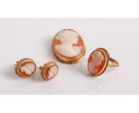 A 9ct gold mounted carved shell cameo brooch, 30 x 24mm, a cameo ring, and a pair of ear studs, each depicting a profile port