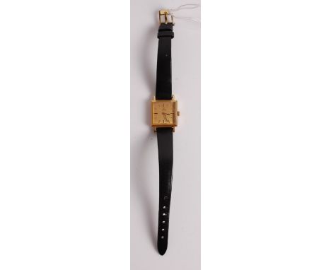 A lady's Omega 18ct gold cased wristwatch, having signed square dial, manual wind movement, and on leather bracelet (possibly