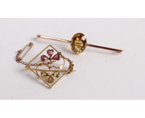 A 9ct gold and smoky topaz set bar brooch, 3.3g, 57mm; together with an early 20th century yellow metal, ruby, green peridot,