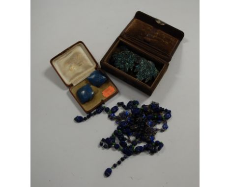 An early 20th century lady's white metal and blue enamel set necklace; together with a scarab beetle necklace, enamelled buck