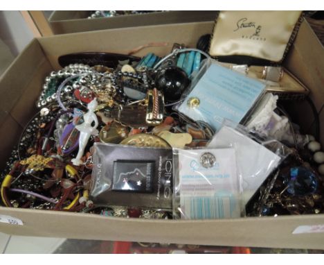 A box of costume jewellery including Mother of pearl cuff links and tie pin by Stratton