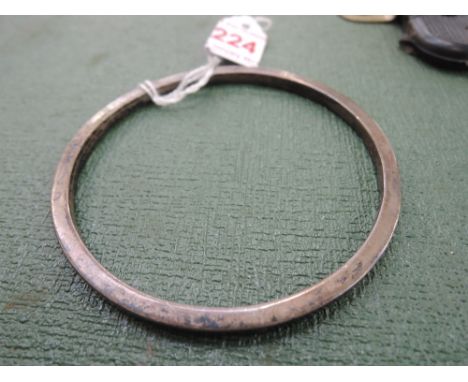 An HM silver hollow slave bangle