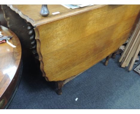 A mid 20th Century oak gate legged table