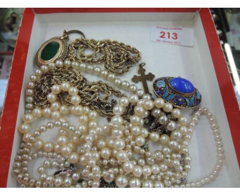 A small selection of costume jewellery including a rolled gold wedding band, gold plated rope chain by Christian Dior, blue e