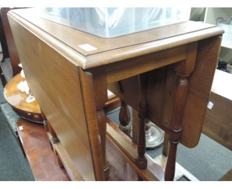 A modern oak gate leg table