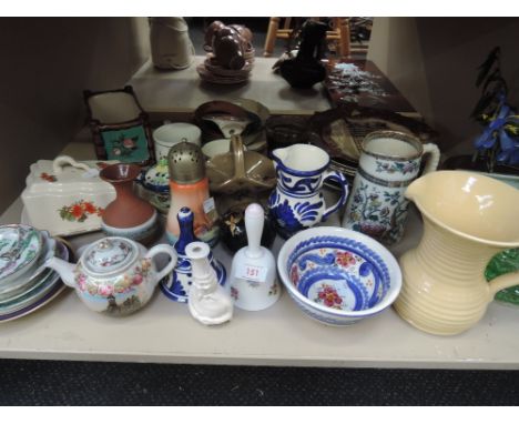 A shelf of mixed ceramics