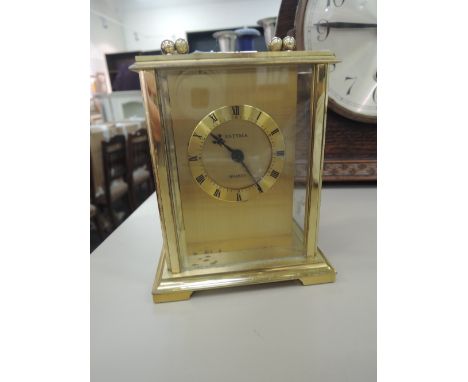 A vintage brass carriage clock
