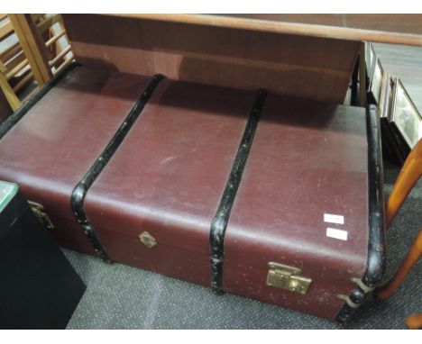 A vintage bound travel trunk