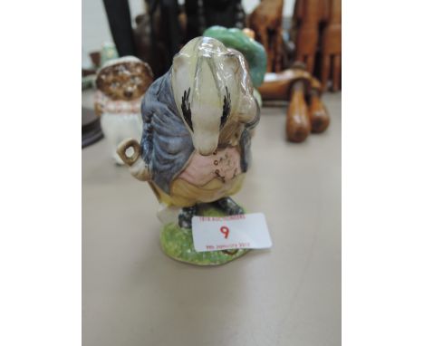 A Beswick Beatrix Potter figure, Tommy Brock, variable eye patch, handle out BP2