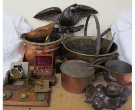 A brass letter scales together with weights, copper and brass cooking pots, carved oak eagle, carved oak fruit etc