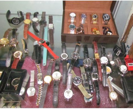 A large collection of Gentleman's wristwatches including Timex, Sekonda, T&J, Limit etc