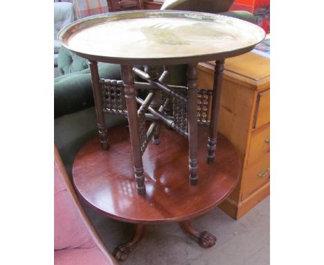 A mahogany occasional table with a tripod base and ball and claw feet, together with a brass topped folding table