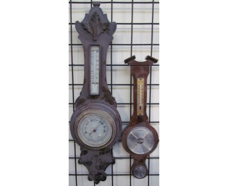 A 20th century oak aneroid barometer together with another barometer