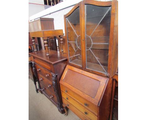 A 20th century oak bureau bookcase together with a Victorian mahogany chest of drawers, an oak sideboard and a commode on tur
