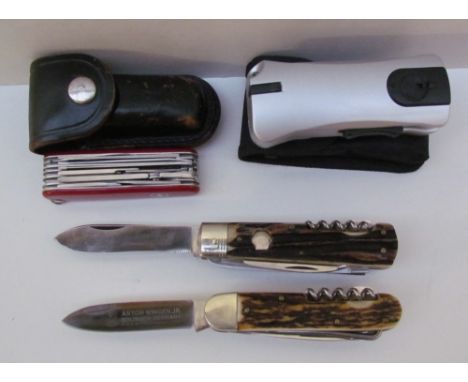A 959 Puma Universal-Jagomesser antler handled hunting knife together with an Anton Wingen Jr antler handled hunting knife, a