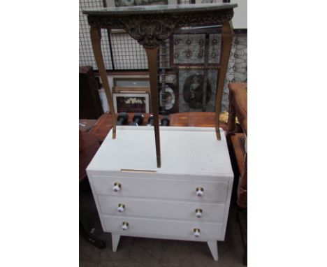 A white painted chest of drawers and a faux marble topped side table