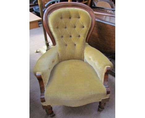 A Victorian mahogany framed spoon back chair, with button back upholstery on turned legs