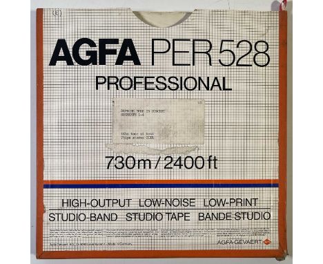 A boxed reel of AGFA PER 528 tape with typed sticker to box 'DEPECHE MODE IN CONCERT SEGMENTS 1-4'.This item is sold as an ar