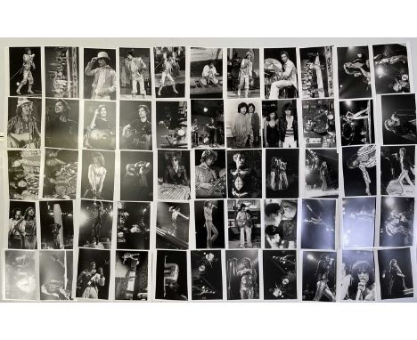 Fifty-seven original glossy black and white press photographs of The Rolling Stones. 8x10". Very good condition. Most with an