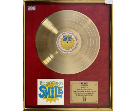 An official BPI presentation gold disc award, given to Nonesuch Records to recognise sales of 100,000 copies of Brian Wilson'