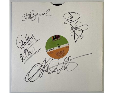 A single sided 12" Yes promo only sampler 'In To The Lens' (SAM 125) signed to plain white cardboard sleeve by Chris Squire, 