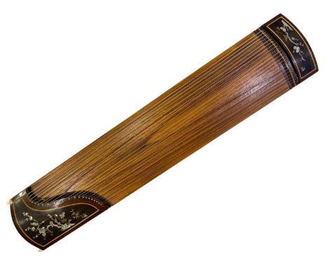 A Chinese guzheng zither harp - 21 strings. Measures at approx 162cm x 36cm