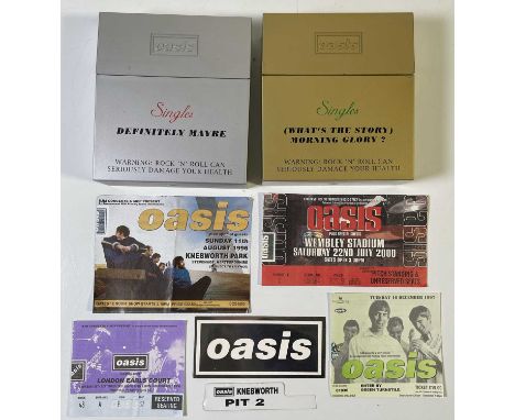 Two Oasis CD single boxsets (CREDM002 and CREMG002), four c 1990s ticket stubs, sticker and part of Knebworth wristband.