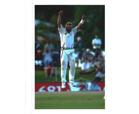 Cricket Shane Warne signed 10x8inch colour photo pictured while playing for Australia in test match cricket. Good condition. 
