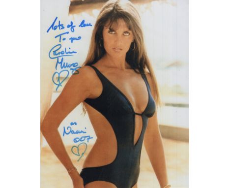 007 James Bond actress and model Caroline Munro signed sexy 8x10 colour photo. Good condition. All autographs come with a Cer
