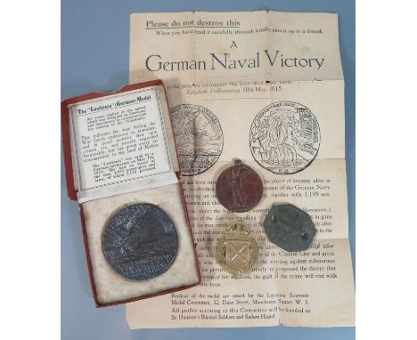 A War Ammunition Volunteer Badge by Gaunt no. 10414, boxed Lusitania Medal with leaflet, WWI medal awarded to 69155. GNR. A.H