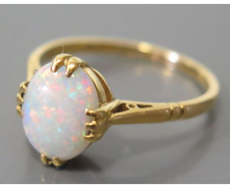 A 22ct Gold and White Opal Ring, size M, 3g