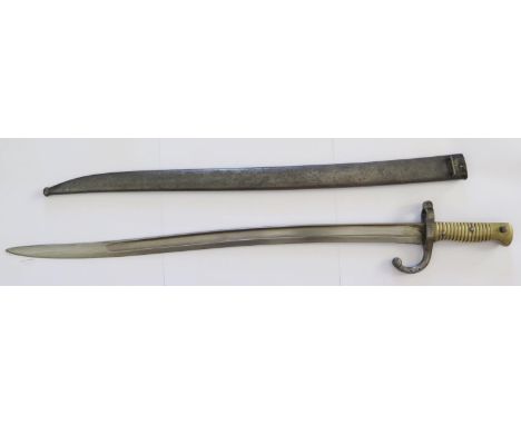 A French 1866 Pattern Remington Bayonet with scabbard, the 57cm blade dated 1872, number N21122 (scabbard E16525) 