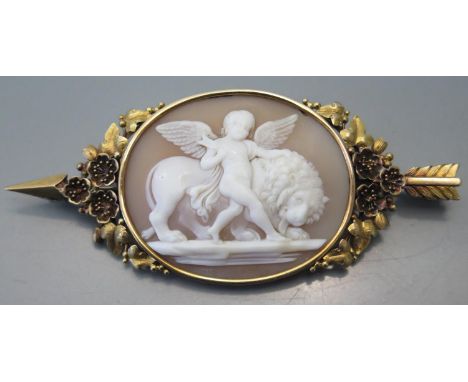 A Nineteenth century Shell Cameo decorated with cupid and lion in a precious yellow mount pierced by Cupid's arrow, 17.5g, 8.
