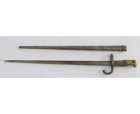 A french 1874 Pattern Bayonet with scabbard, the 52cm blade dated 1878 