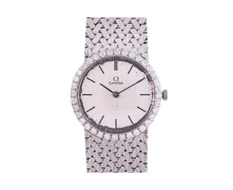 AN OMEGA LADIES WHITE GOLD AND DIAMOND BRACELET WATCH
Circa 1960s, Serial No. 20524999,
18k white gold case, case interior nu